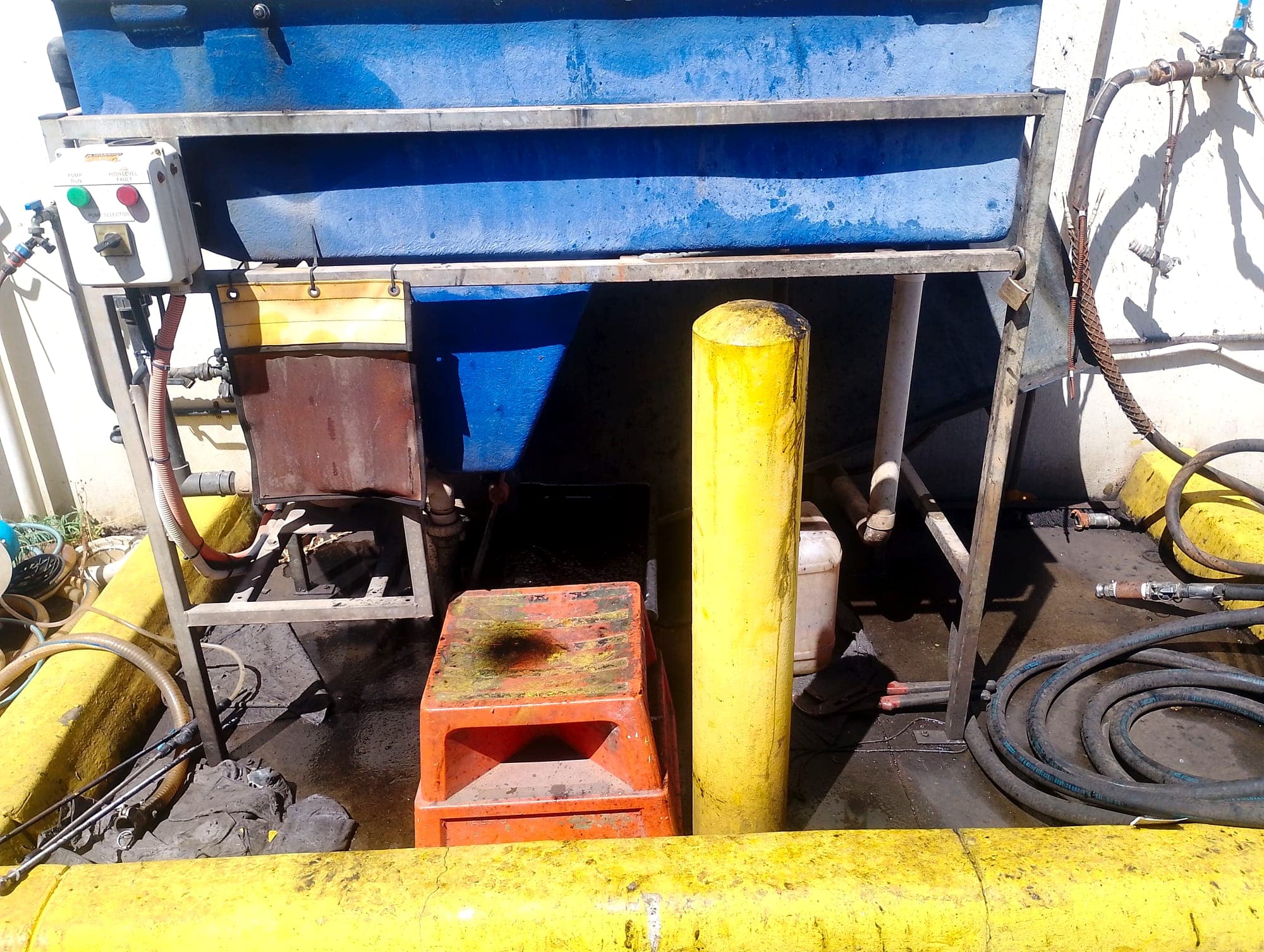 Oil water separator being cleaned out
