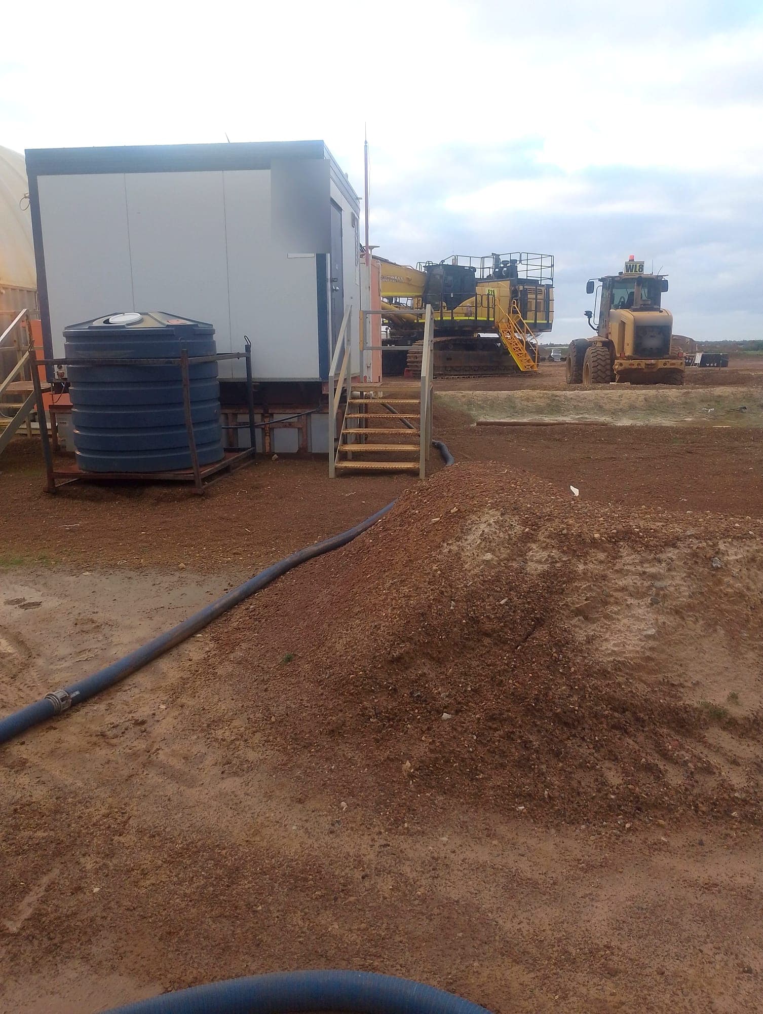 Pumping out the underbelly tank on a site toilet block